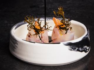 A crudo with grapefruit, wasabi, and garum features rockfish from Bodega Bay, Calif., caught by artisanal fisherman Seth Caillat, who practices a traditional Japanese fishing method called Ikejime.
